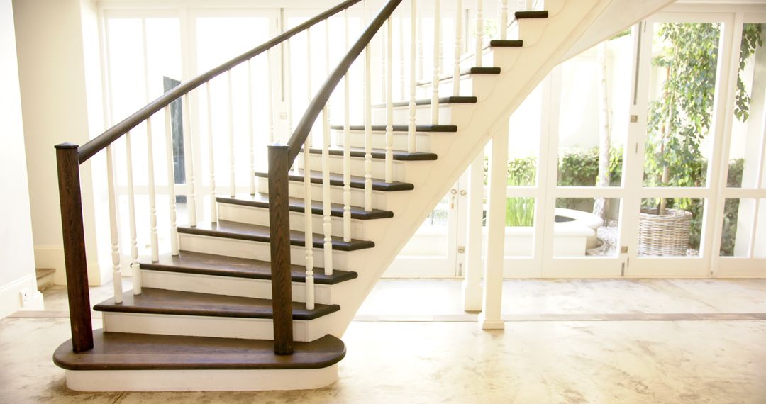 Elegant Curved Staircase in Modern Interior with Wooden Steps
