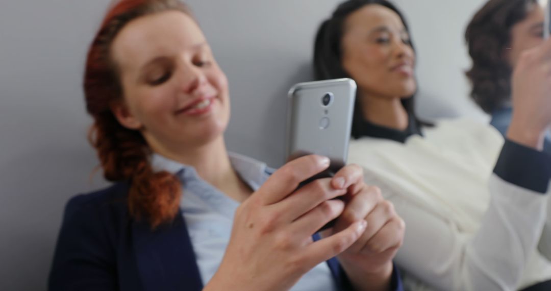 Group of Diverse Women Relaxing and Using Smartphones While Sitting - Free Images, Stock Photos and Pictures on Pikwizard.com