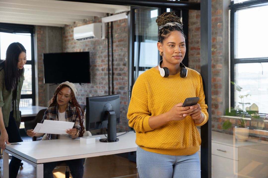 Diverse Female Team Collaborating in Creative Office Environment