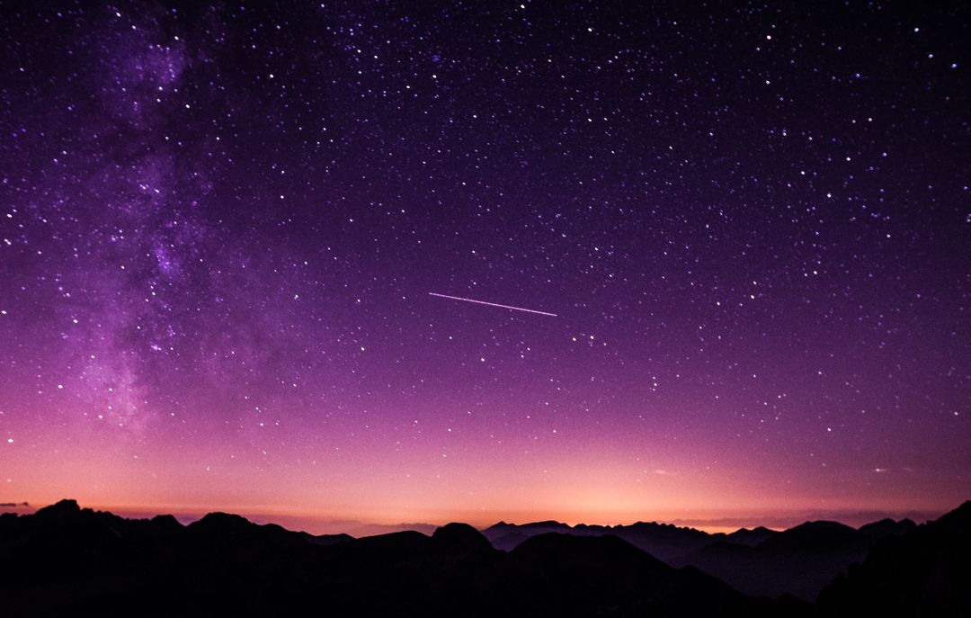 Stunning Night Sky with Milky Way and Shooting Star Over Mountains - Free Images, Stock Photos and Pictures on Pikwizard.com