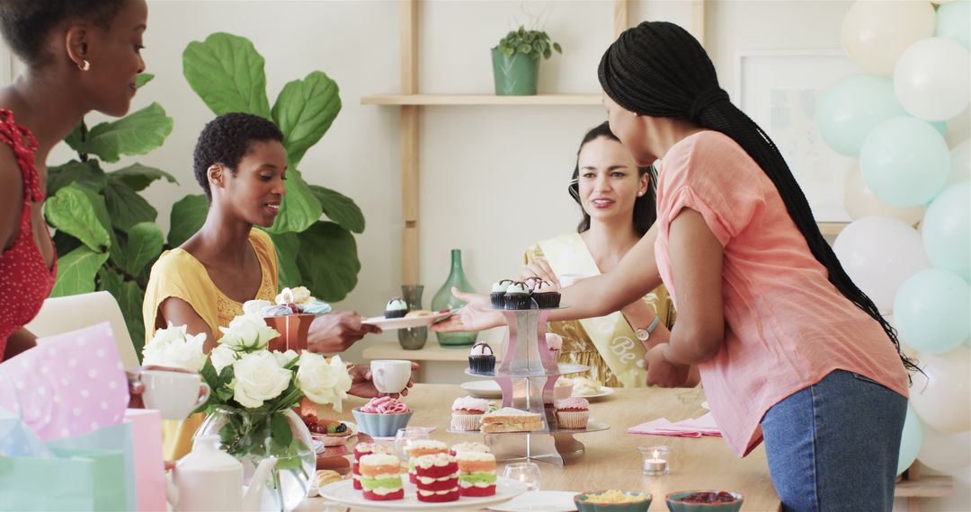 Diverse Female Friends Celebrating with Desserts at Home Gathering