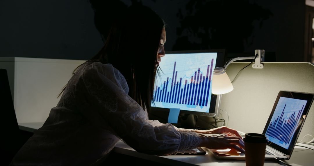 Dedicated Young Executive Analyzing Data in Modern Office