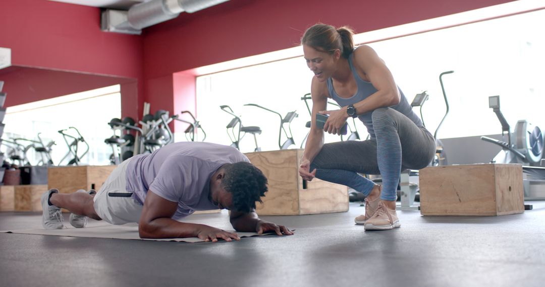 Focused Gym Workout With Motivating Trainer