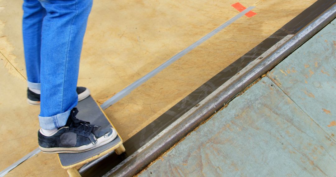 Close-Up of Skateboarder Balancing on Ramp Wear Blue Jeans - Free Images, Stock Photos and Pictures on Pikwizard.com