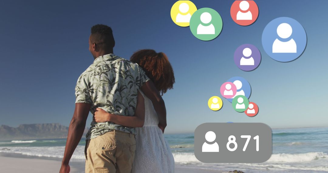 Couple Strolling Along Beach with Social Media Networking Icons