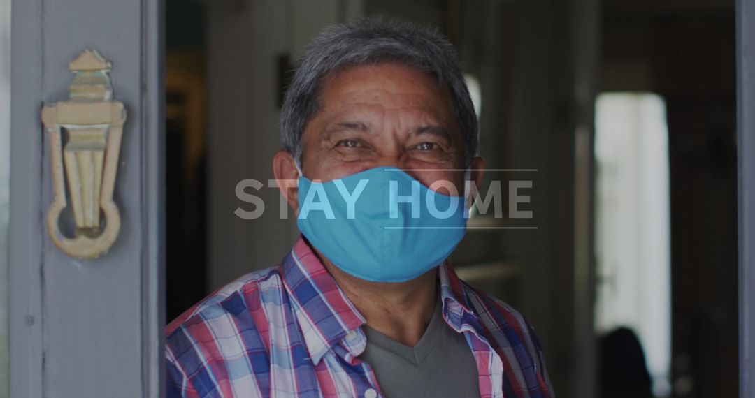 Smiling Senior Man in Mask Practicing Home Isolation for Safety