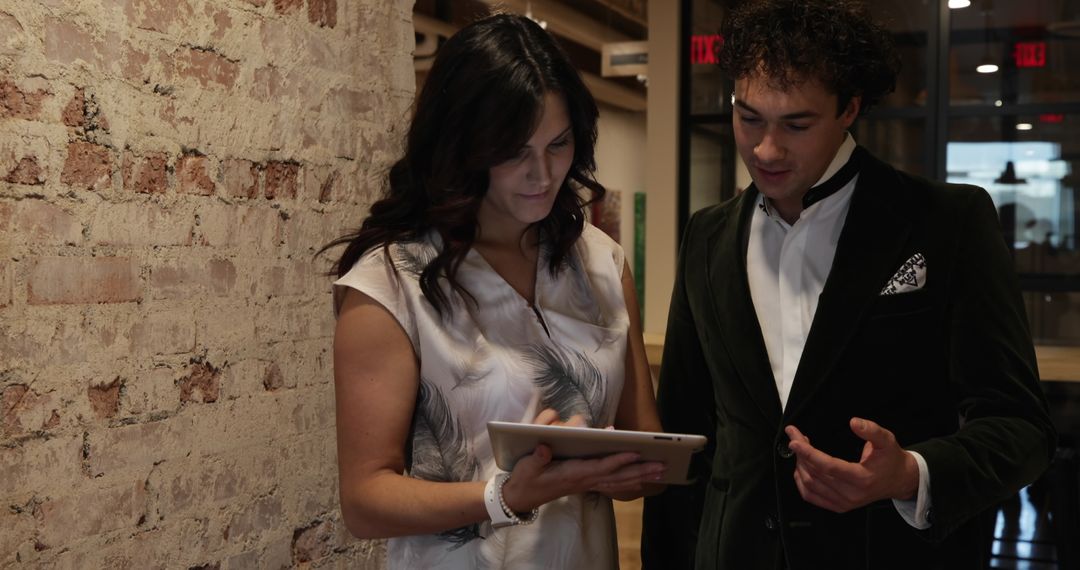 Colleagues Collaboration in Modern Office Using Tablet Technology