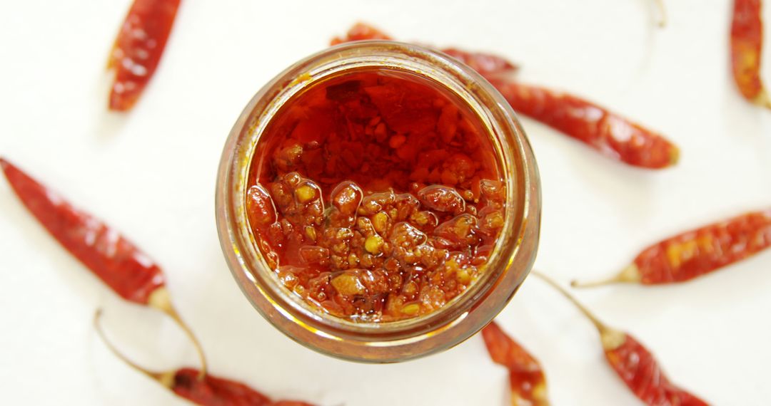 Top View of Jar with Spicy Chili Paste and Dried Red Chilies - Free Images, Stock Photos and Pictures on Pikwizard.com