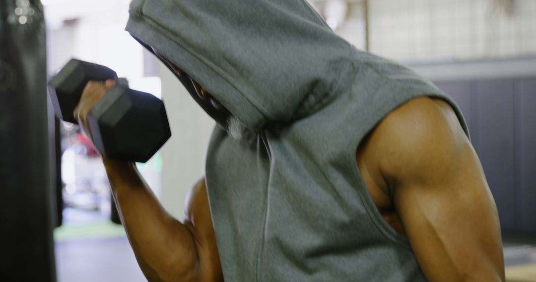 Strong Athlete Lifting Dumbbell in Gym - Free Images, Stock Photos and Pictures on Pikwizard.com