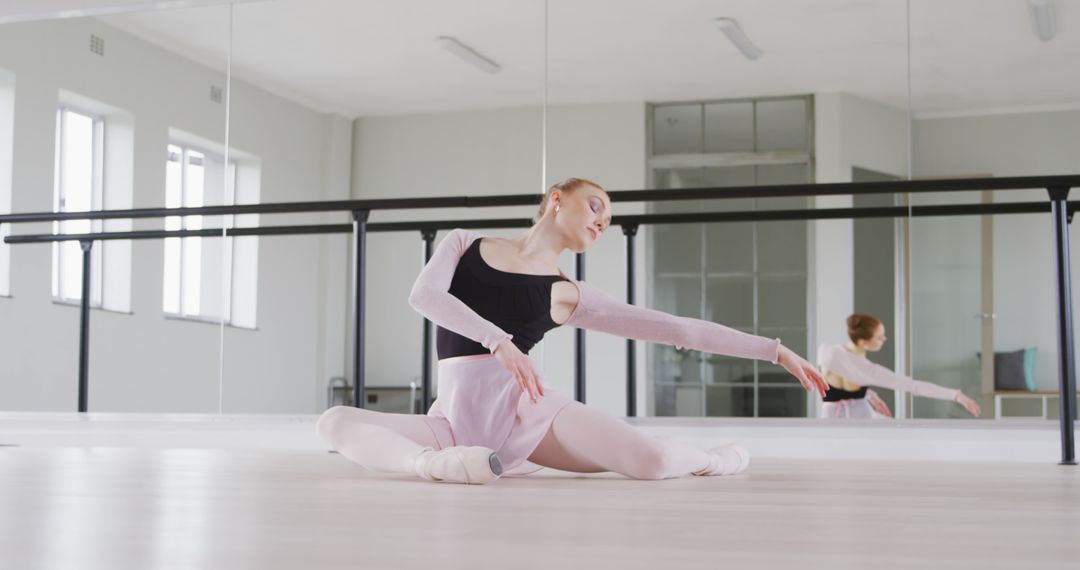 Graceful Ballet Dancer Practicing in Studio with Mirrors