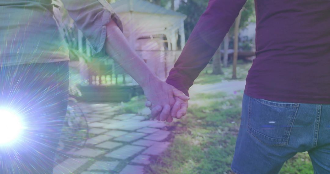 Romantic Mature Couple Strolling Hand in Hand in Garden