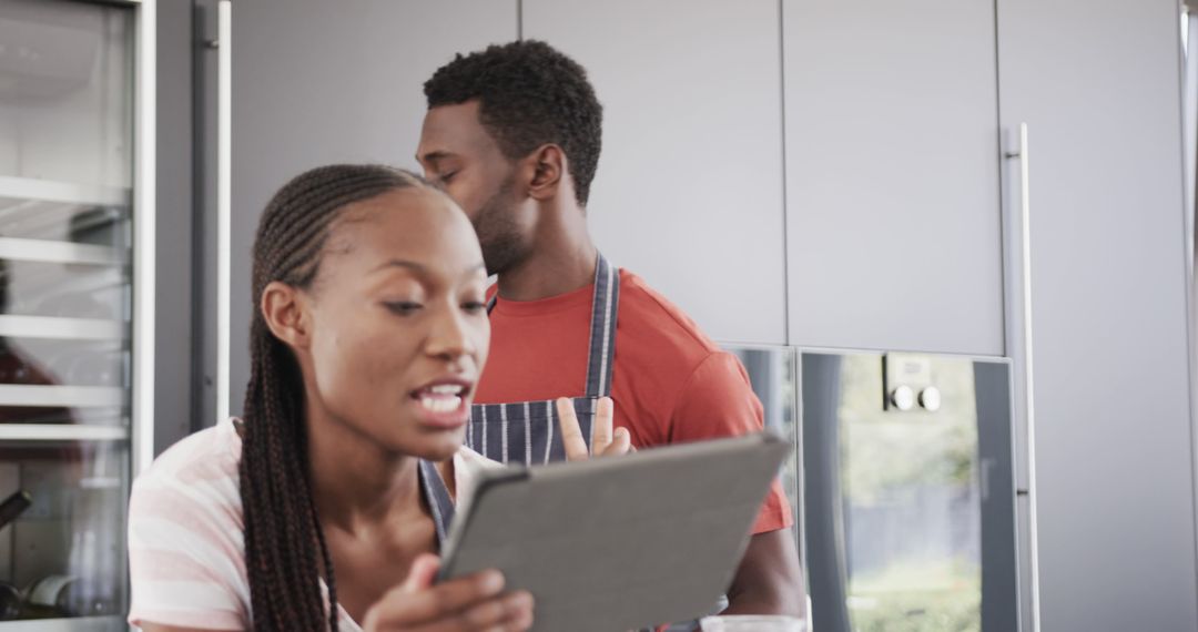 Couple Exploring Recipe on Tablet in Modern Kitchen