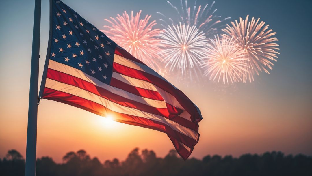 American Flag Waving at Sunset with Fireworks in Twilight