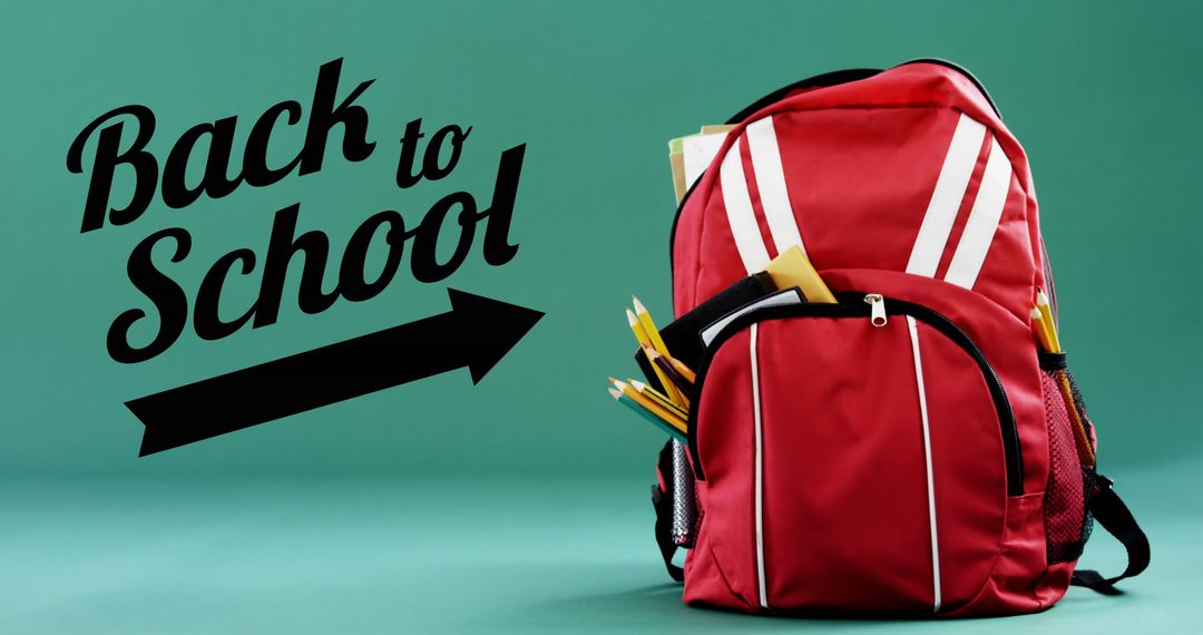 Back to School Concept with Red Backpack on Green Background