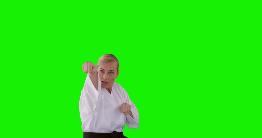 Female Karate Instructor Posing in White Gi Uniform on Green Screen - Free Images, Stock Photos and Pictures on Pikwizard.com