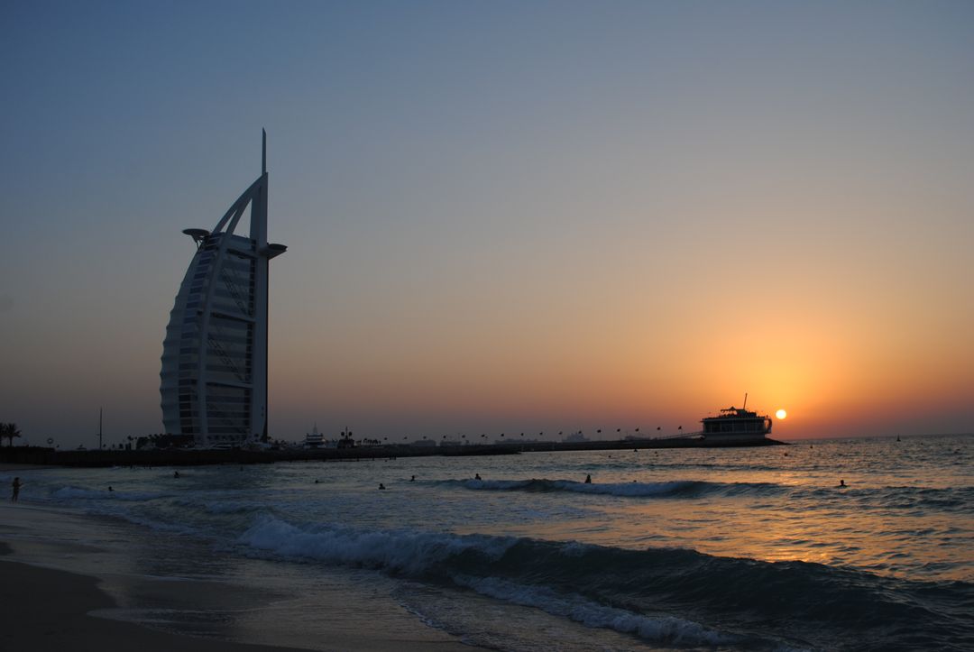 Sunset Over Iconic Hotel and Beach in Dubai - Free Images, Stock Photos and Pictures on Pikwizard.com