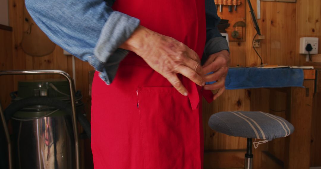 Carpenter Tying Apron in Workshop - Free Images, Stock Photos and Pictures on Pikwizard.com