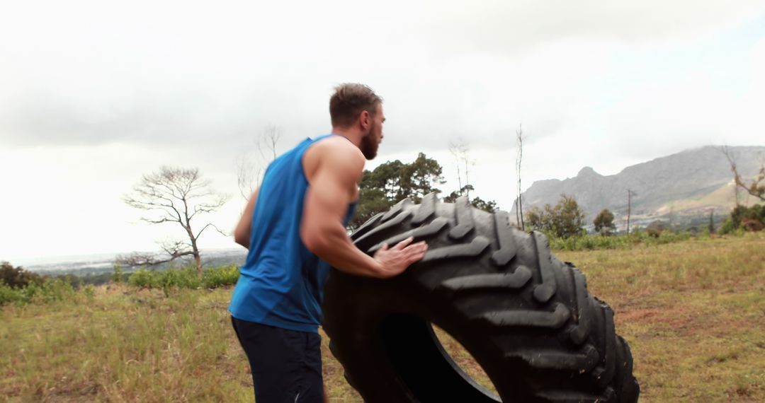 Man Flipping Tire in Outdoor Fitness Training Session - Free Images, Stock Photos and Pictures on Pikwizard.com