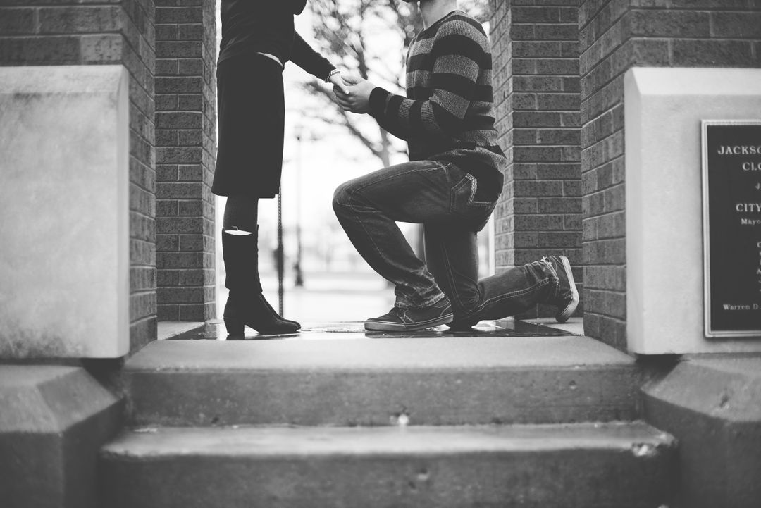 Black and white couple kneeling love - Free Images, Stock Photos and Pictures on Pikwizard.com