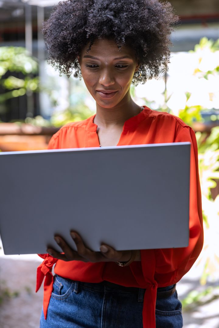 Confident Professional Engaged in Outdoor Work Using Modern Laptop