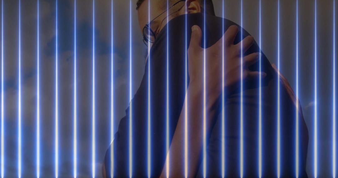 Romantic Embrace in Blue Neon Installation Setting