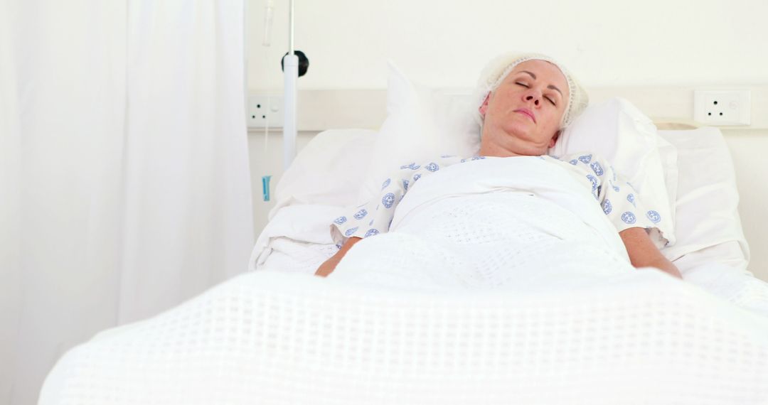 Elderly Patient Resting in Hospital Bed After Surgery - Free Images, Stock Photos and Pictures on Pikwizard.com