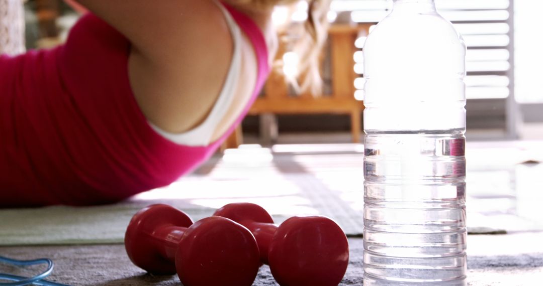 Women Exercising at Home with Weights and Water Bottle - Free Images, Stock Photos and Pictures on Pikwizard.com