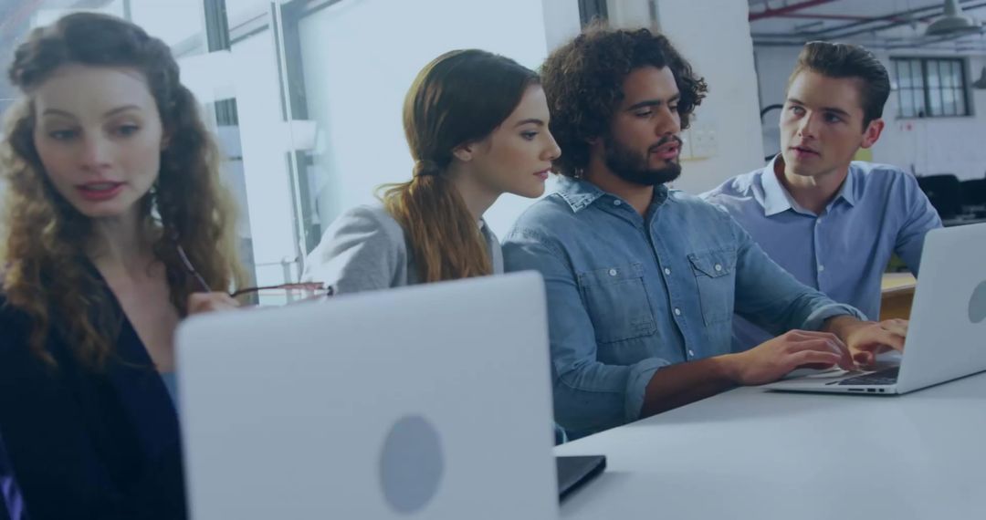 Diverse Team Brainstorming at Modern Office Desk