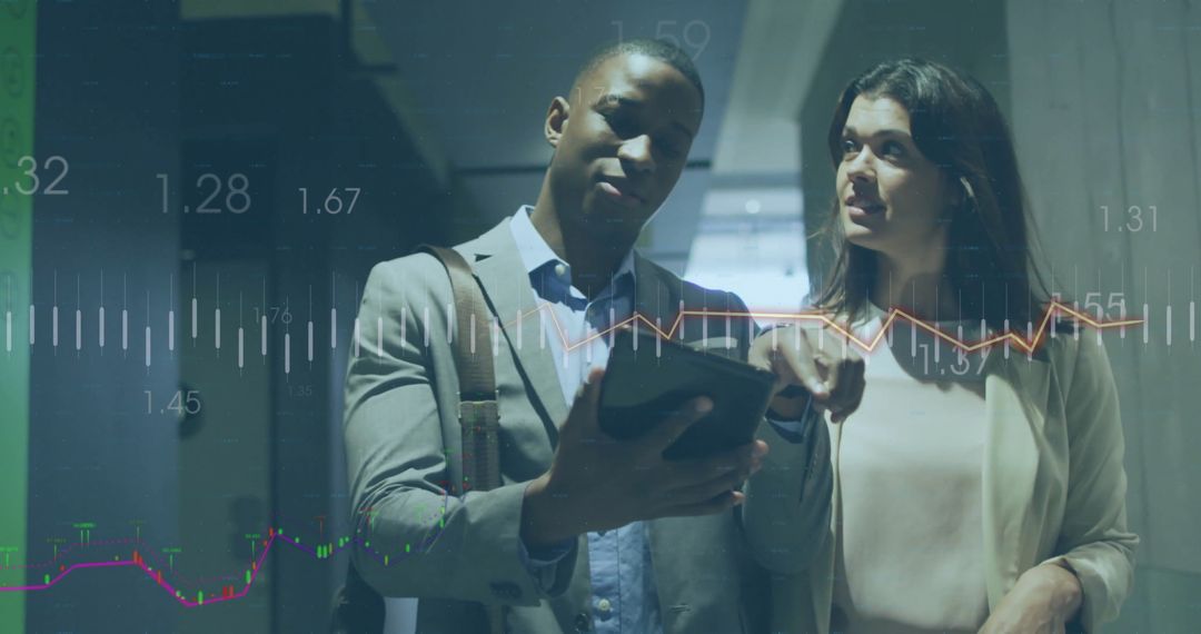 Diverse Business Professionals Analyzing Financial Data on Digital Tablet