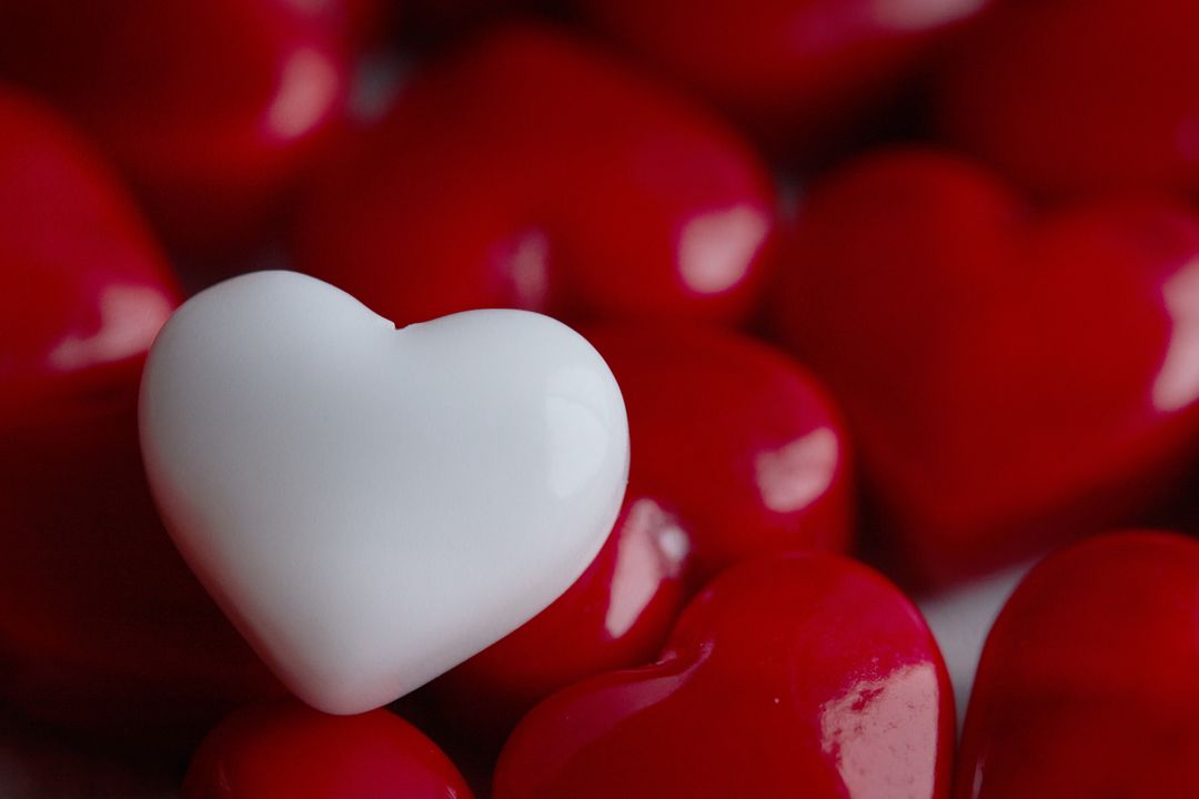 White Heart Among Red Hearts Symbolizing Unity in Diversity