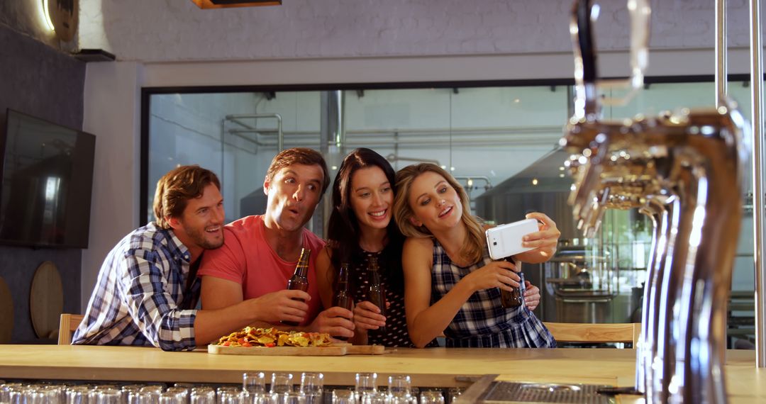 Group of Friends Taking Selfie in a Bar Enjoying Social Moment