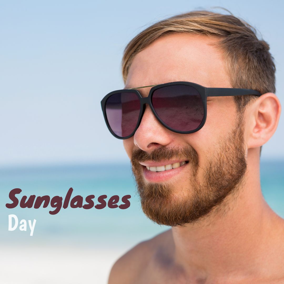 Young Man Smiling with Sunglasses Stake Out Vibrant Sea and Sky