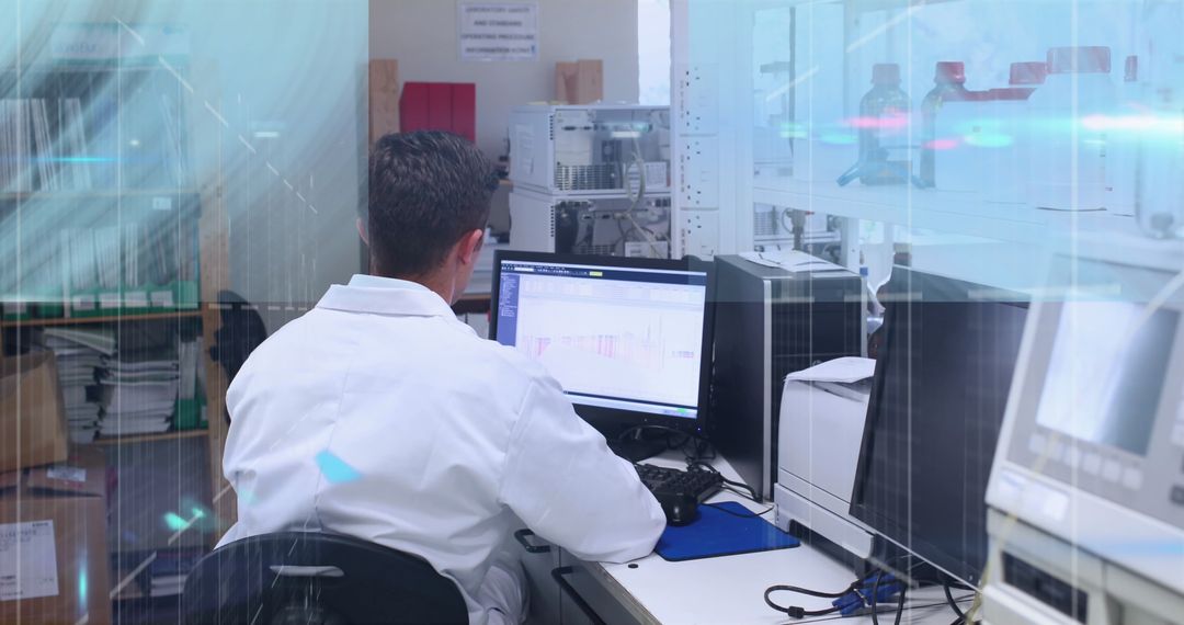 Scientist in laboratory analyzing data on computer