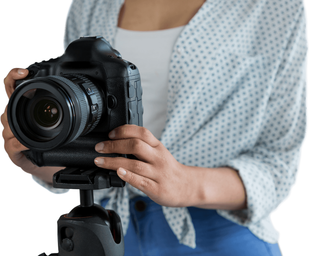 Young Woman Adjusting Camera on Tripod Transparent Background