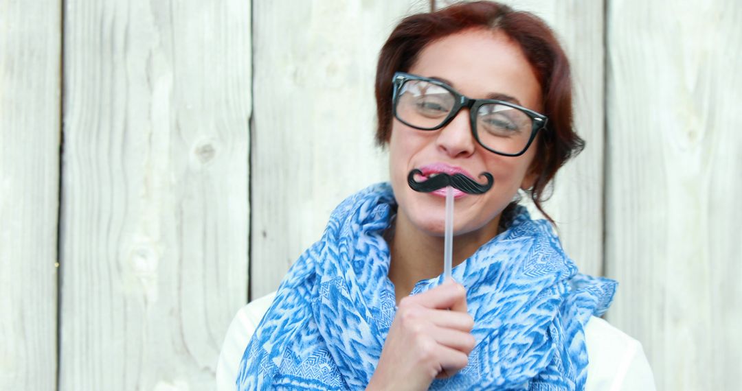 Playful Woman Wearing Fake Mustache and Glasses - Free Images, Stock Photos and Pictures on Pikwizard.com