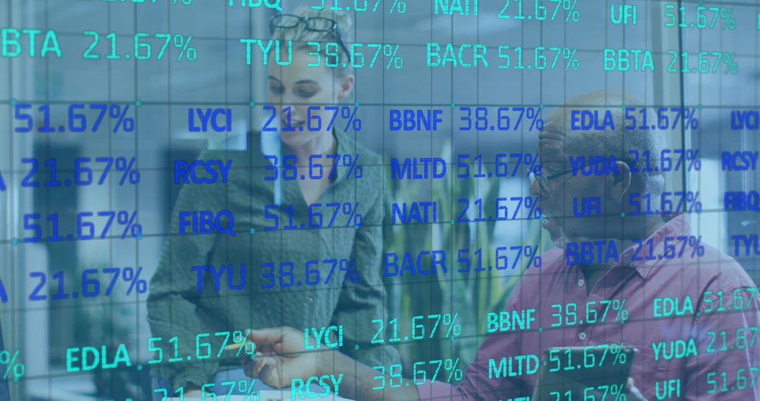 Financial Analysts Discussing Stock Figures on Digital Display