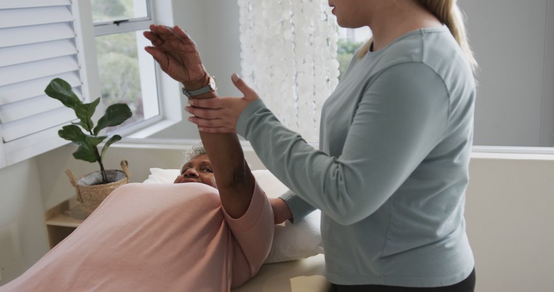 Physiotherapist Assisting Senior Woman During Rehabilitation Session - Free Images, Stock Photos and Pictures on Pikwizard.com