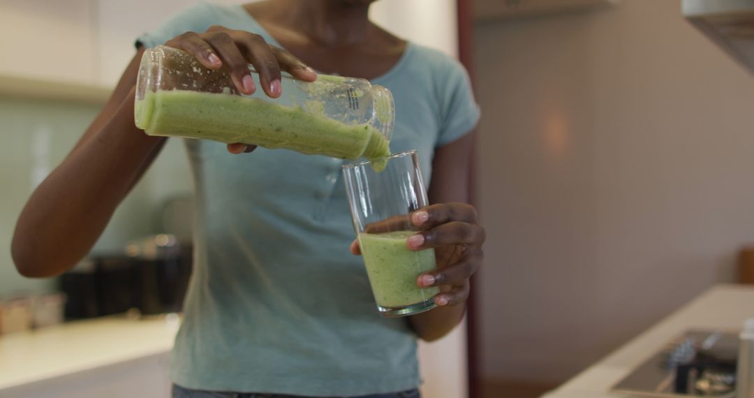 Preparing Healthy Green Smoothie in Modern Kitchen - Free Images, Stock Photos and Pictures on Pikwizard.com