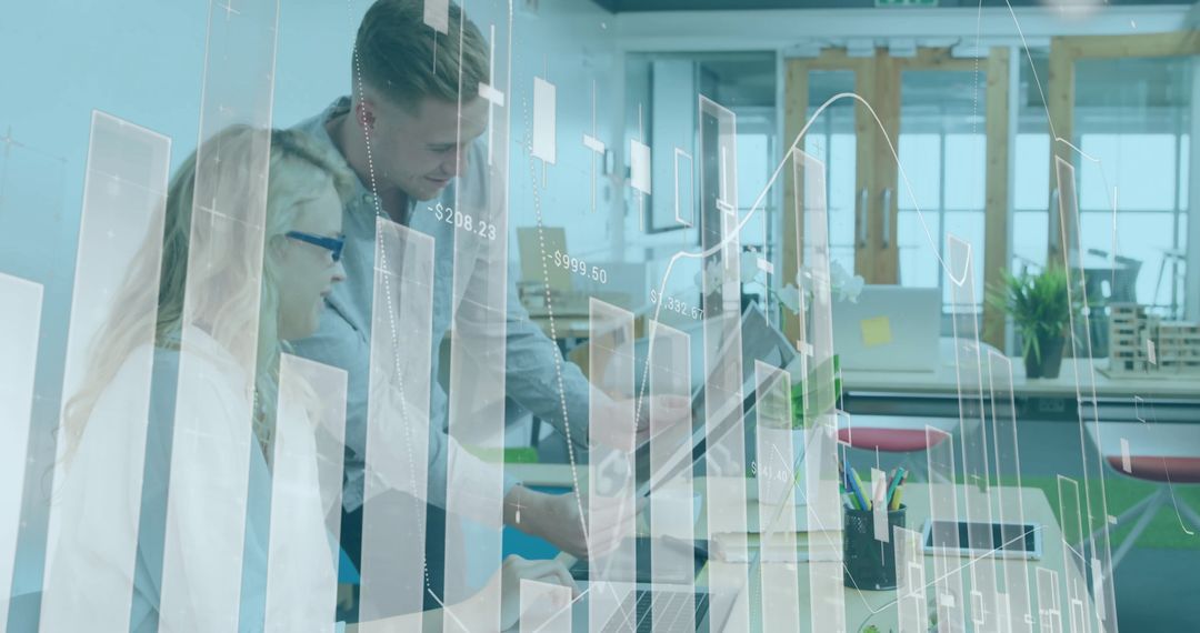 Collaborating Financial Analysts Analyzing Computer Data in Modern Office