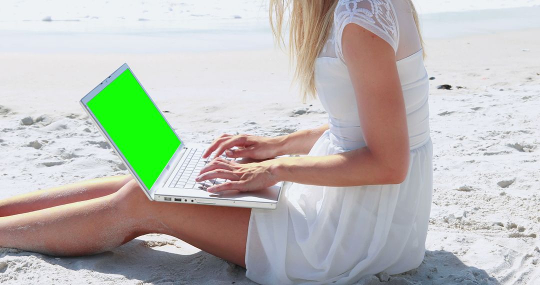 Woman Working on Laptop with Green Screen at Beach - Free Images, Stock Photos and Pictures on Pikwizard.com