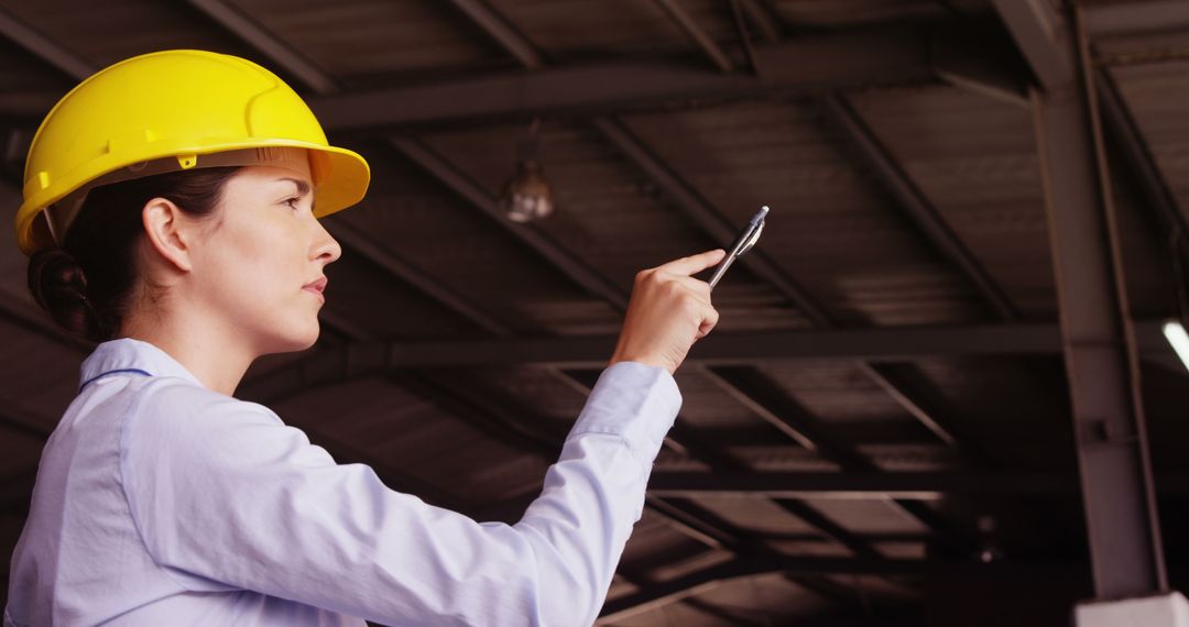 Female Engineer Conducting Factory Inspection with Hard Hat - Free Images, Stock Photos and Pictures on Pikwizard.com