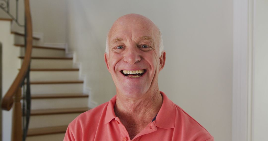 Smiling Senior Man in Home Interior