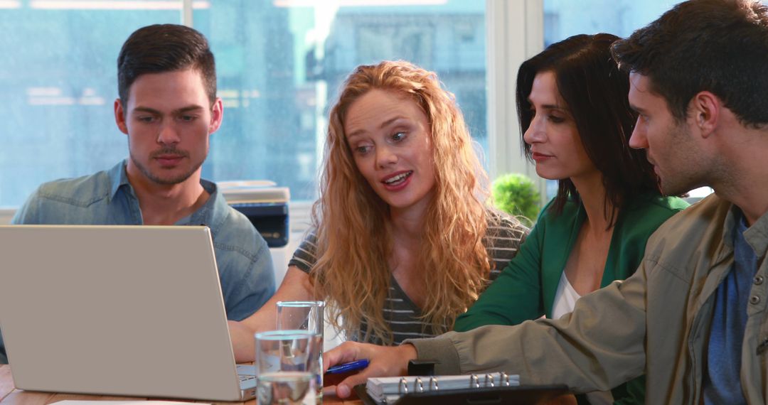 Diverse Team Collaborating on Project in Office Meeting