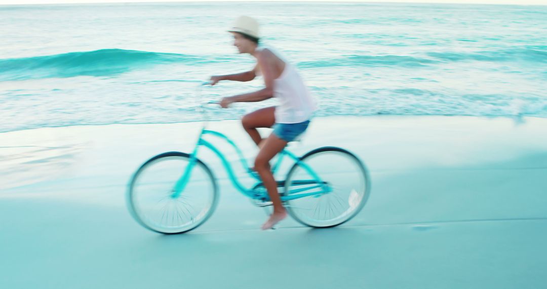 Beautiful woman cycling on the beach on a sunny day 4k - Free Images, Stock Photos and Pictures on Pikwizard.com