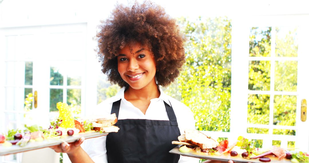 Smiling Waitress Serving Platters in Bright Restaurant - Free Images, Stock Photos and Pictures on Pikwizard.com