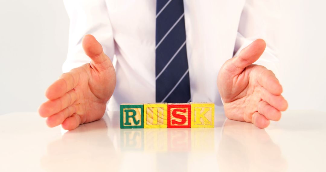 Business Concept of Risk Management with Hands Protecting Wooden Blocks - Free Images, Stock Photos and Pictures on Pikwizard.com