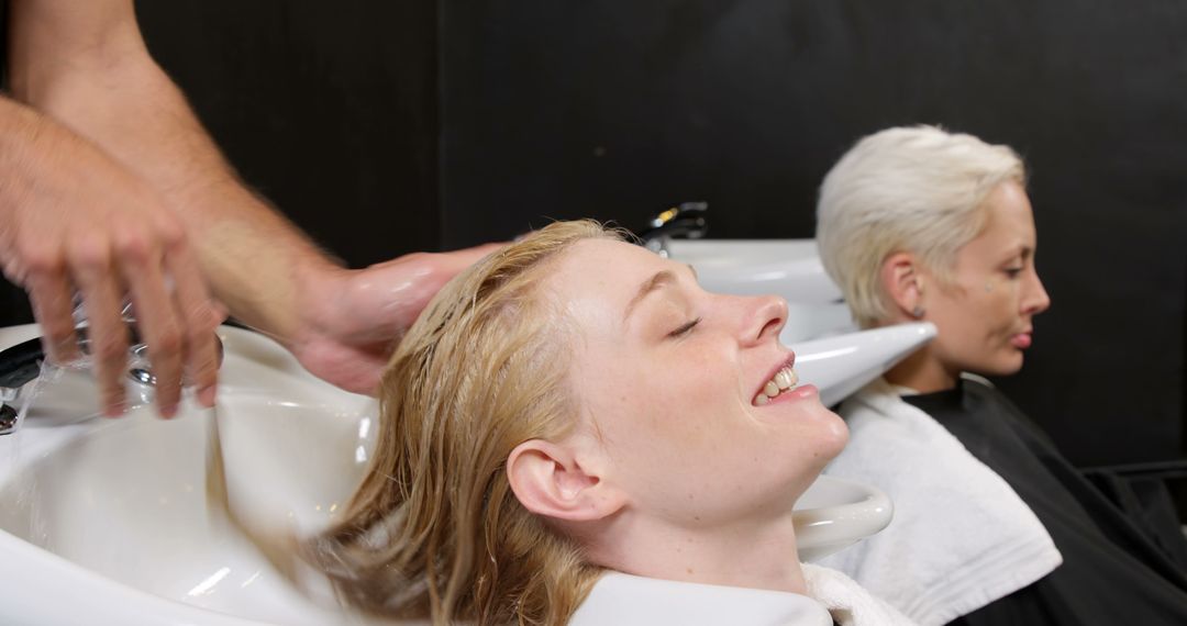 Women Enjoying Hair Washing Treatments at Salon - Free Images, Stock Photos and Pictures on Pikwizard.com