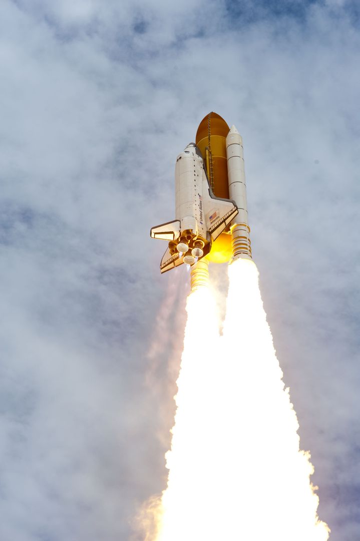 Space Shuttle Launching Into Blue Partly Cloudy Sky - Free Images, Stock Photos and Pictures on Pikwizard.com