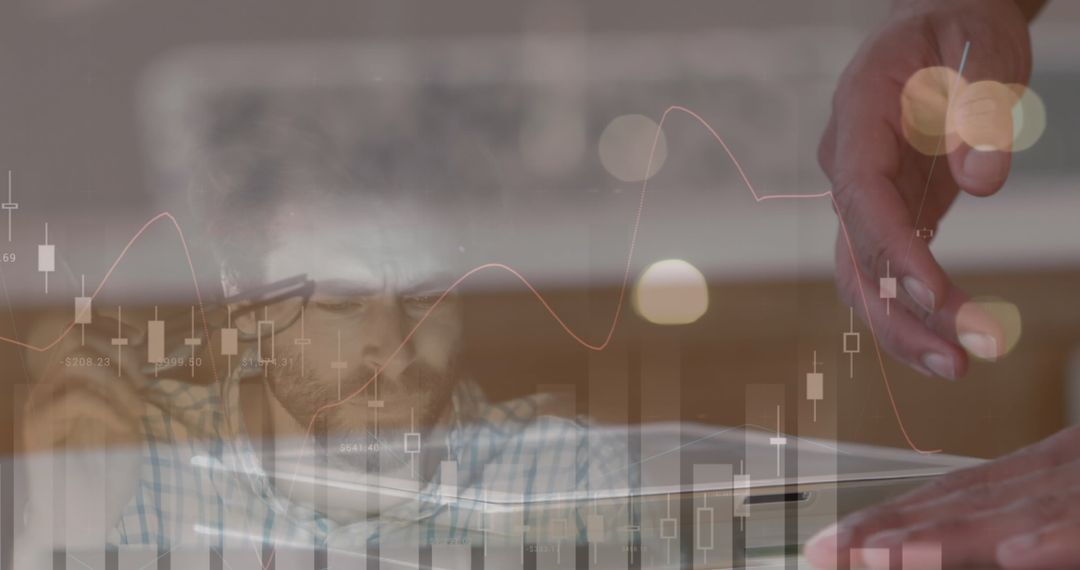 Businessman Analyzing Financial Data on Tablet with Overlaid Graphs