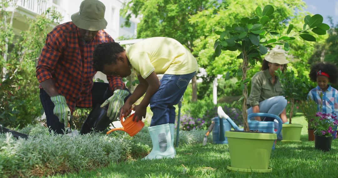 African American Family Gardening Together in Backyard - Free Images, Stock Photos and Pictures on Pikwizard.com